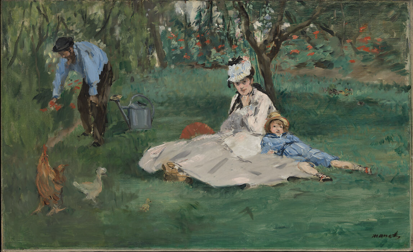 Picknick im Grünen mit Frau, Kind und Mann im Garten